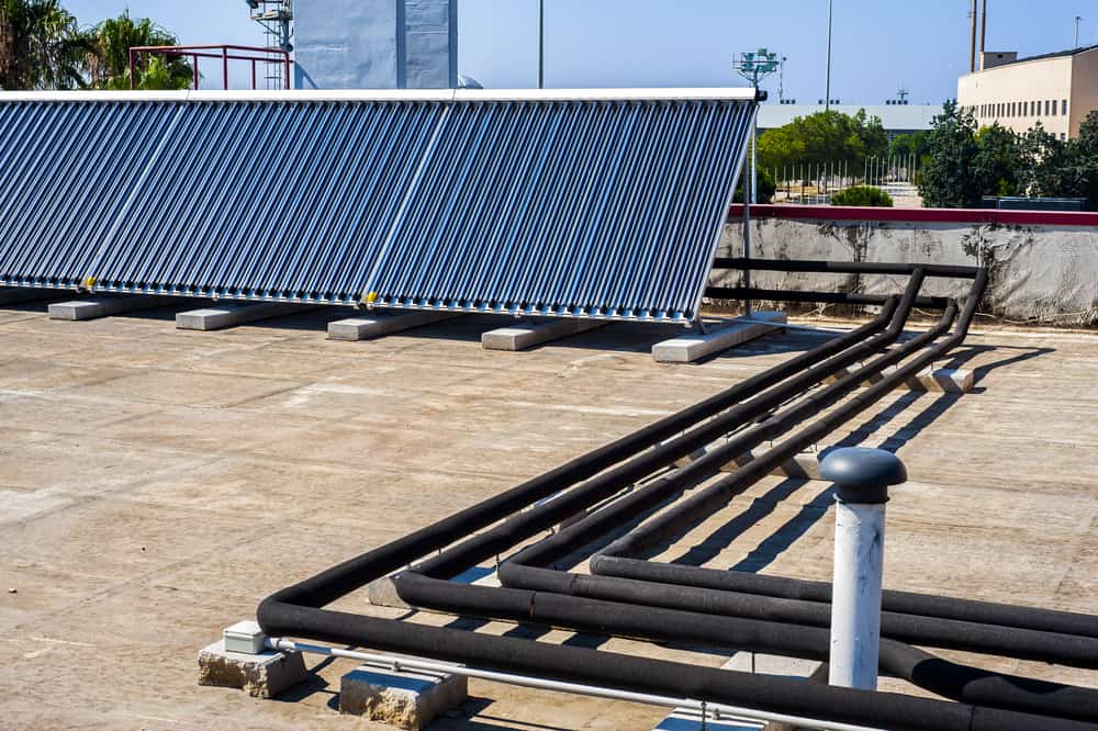 A rooftop solar water heating array - Benefits of Solar Pool heating